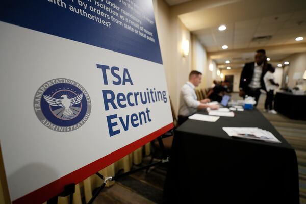 People gather inside the Holiday Inn & Suites near the Atlanta airport, where the Transportation Security Administration held a job fair. TSA offers a $1,000 signing bonus for Atlanta airport jobs during the recruiting event Tuesday and Wednesday, June 7-8. Miguel Martinez / miguel.martinezjimenez@ajc.com