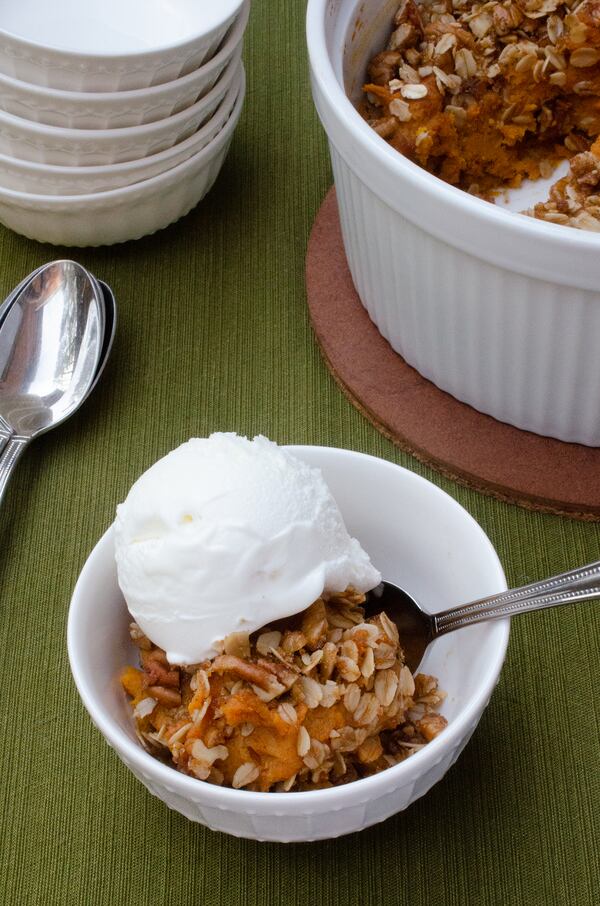 Sweet Potato Crisp is a homey dessert that is a comfort food mashup of sweet potato pie and a buttery crisp. (Virginia Willis for The Atlanta Journal-Constitution)