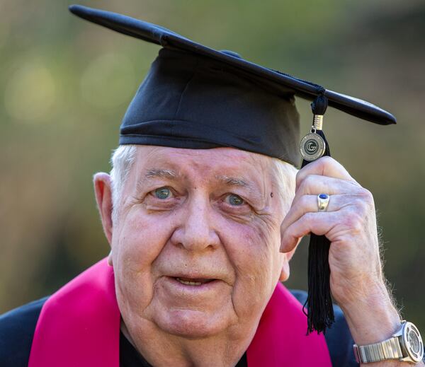 Portrait of 82-year-old Prescott Lawrence in his graduation cap & gown at his home in Grayson, Ga. He graduated in August, at age 81, from Georgia Gwinnett College with a degree he never plans to use. He believes the key to life is feeding the mind and caring for the body. PHIL SKINNER FOR THE ATLANTA JOURNAL-CONSTITUTION.