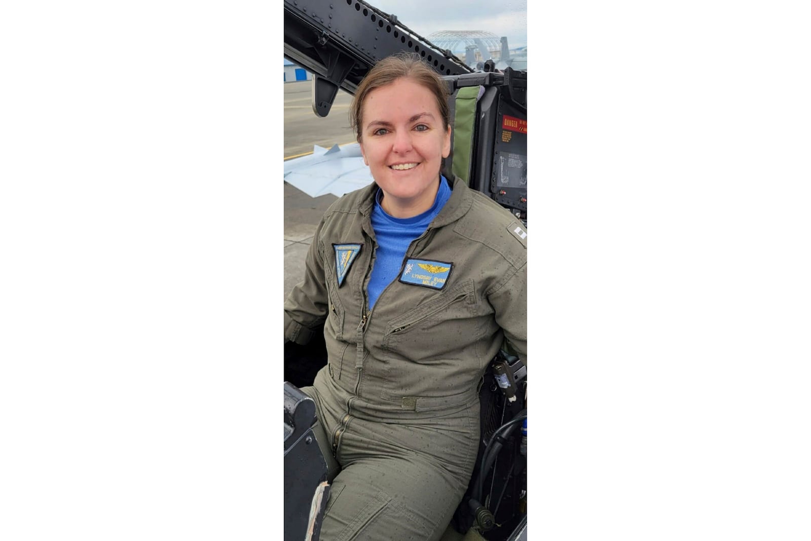 In this undated photo released by the U.S. Navy, Lt. Commander Lyndsay Evans sits in a cockpit. (U.S. Navy via AP)