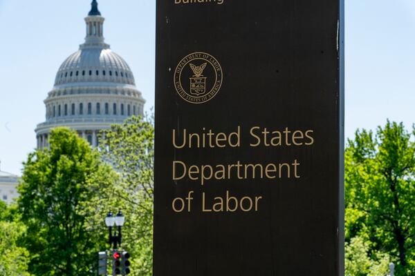 FILE - In this May 7, 2020, photo, the entrance to the Labor Department is seen near the Capitol in Washington. s a nation ravaged by the coronavirus pandemic, the economic devastation upending the presidential campaign and forcing President Donald Trump to overcome historic headwinds to win a second term. (AP Photo/J. Scott Applewhite, File)