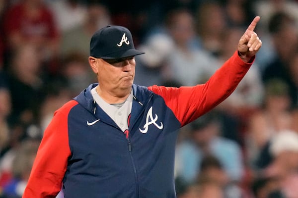 Atlanta Braves manager Brian Snitker calls for a new pitcher during the fourth inning of the team's baseball game against the Boston Red Sox at Fenway Park, Tuesday, July 25, 2023, in Boston. (AP Photo/Charles Krupa)