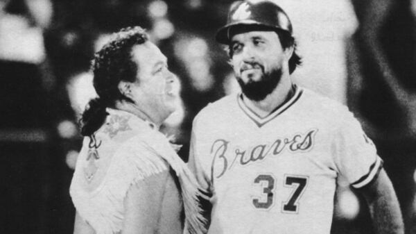  Rick Camp is congratulated by Braves mascot Chief Noc-A-Homa after his 18th-inning home run that tied the game against the Mets.