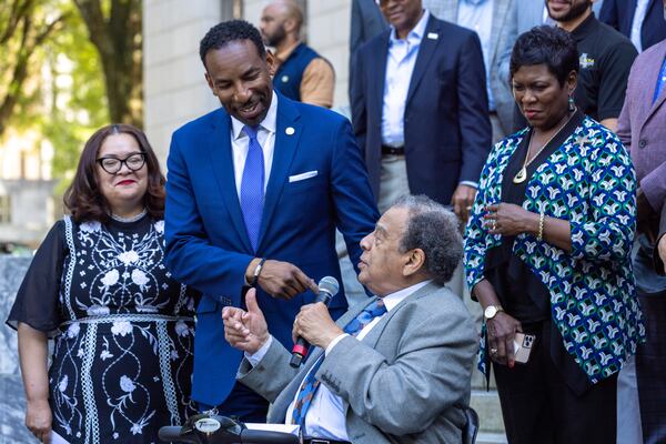 Atlanta Mayor Andre Dickens reacts as former Atlanta mayor Andrew Young speaks about the Atlanta Public Safety Training Center at a press conference in front of Atlanta City Hall on Wednesday, April 19, 2023. (Arvin Temkar / arvin.temkar@ajc.com)