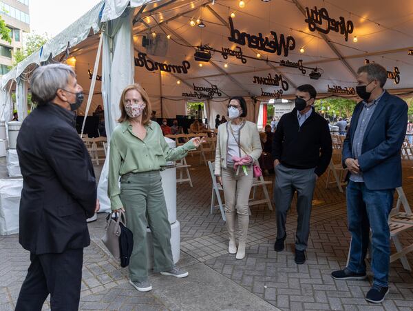 Stephen Schwartz (left) is introduced by Alliance Theatre's Artistic Director Susan Booth to theater supporters Lila Hertz and Doug Hertz at the Alliance Theater, before the premiere of a new production of his 1978 show "Working."  Jenni Girtman for The AJC