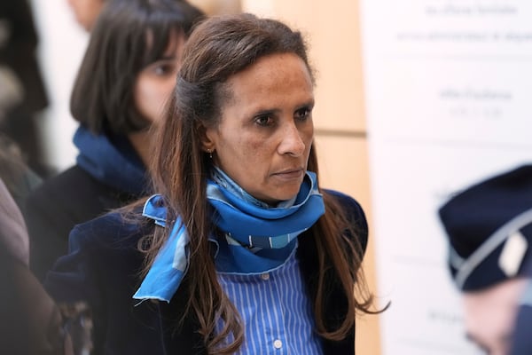 Karine Silla leaves the courtroom while actor Gerard Depardieu is on trial for the alleged sexual assaults of two women on a film set in 2021, Tuesday, March 25, 2025 in Paris. (AP Photo/Aurelien Morissard)