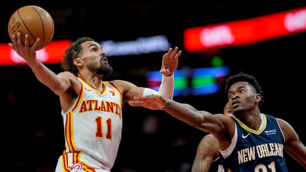 Atlanta Hawks guard Trae Young (11) shoots against New Orleans Pelicans center Yves Missi (21) during the second half of an NBA basketball game, Monday, Dec. 2, 2024, in Atlanta. (AP Photo/Mike Stewart)