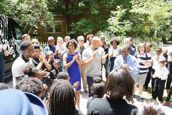 Atlanta Music Project staff and students who had kept a major donation from the new Fox TV show "Knock Knock Live" secret from the nonprofit's executive director Dantes Rameau are excited at the moment of the big reveal. Musician-actor Common (center), a show guest host, shares the moment wth Rameau (right, in blue shirt and tie). Aisha Bowden, AMP's co-founder who nominated Rameau, is on the other side of Common. CONTRIBUTED BY FOX