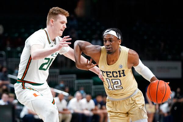 Georgia Tech forward Khalid Moore drives past Miami forward Sam Waardenburg during the first half Wednesday night in Coral Gables, Florida. (AP Photo/Wilfredo Lee)