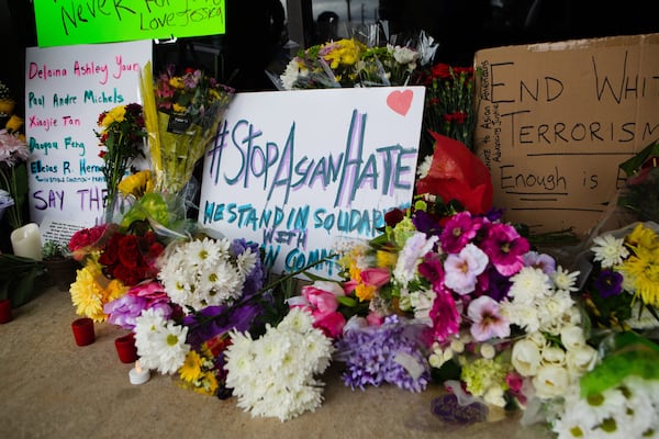 A memorial set up in front of Youngs Asian Massage honored the victims of the spa shooting in Cherokee County.