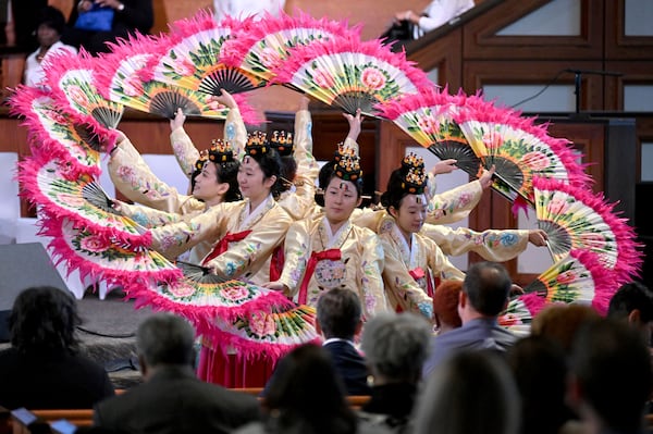 Members of Korean fan dance team perform during pre-program event before the 57th Martin Luther King, Jr. Beloved Community Commemorative Service at Ebenezer Baptist Church, Monday, January 20, 2025, in Atlanta. (Hyosub Shin / AJC)