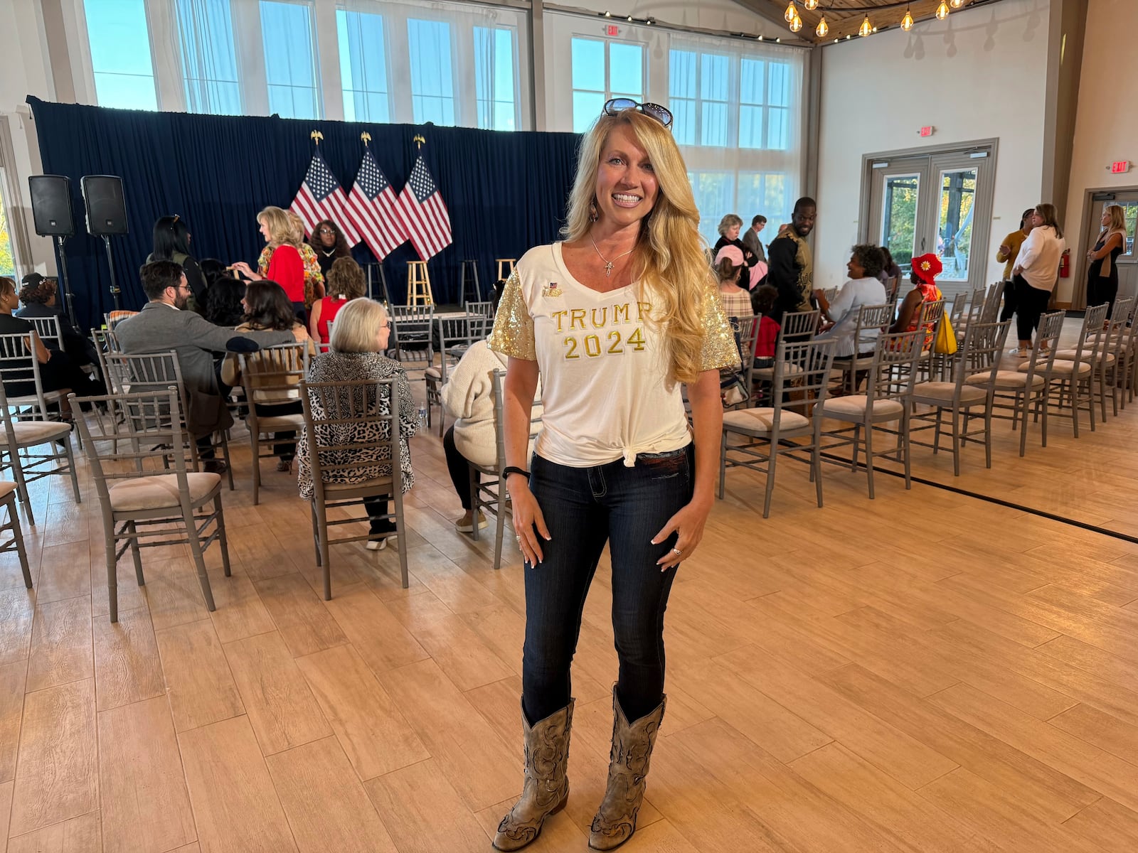 Georgia Trump supporter Candace Duvall poses for a photo while attending Team Trump's Women's Tour in South Fulton, Ga. on Thursday, Oct. 24, 2024. (AP Photo/Charlotte Kramon)