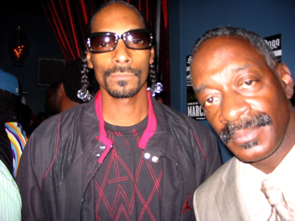 In an undated photo, Snoop Dogg (left) and a man who introduced himself as Papa Snoop are seen at Dogg's "Ego Trippin" listening party at Magic City. (AJC File)