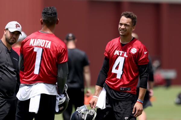 Falcons quarterbacks Marcus Mariota, left, and Desmond Ridder are shown during OTAs at the Falcons training facility Thursday, June 9, 2022, in Flowery Branch, Ga. (Jason Getz / Jason.Getz@ajc.com)