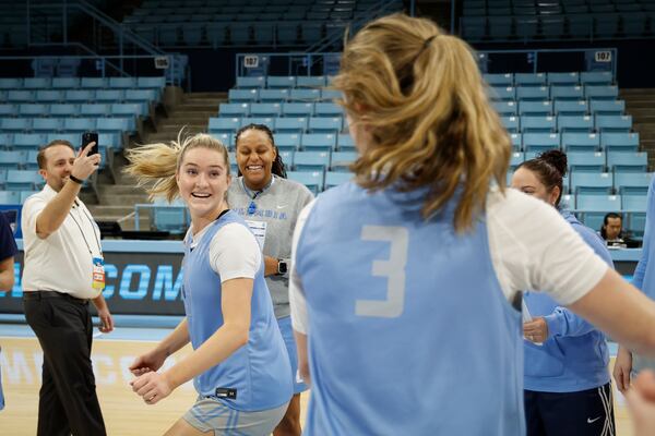 Columbia guards Kitty Henderson, left, and Cecelia Collins (3) share a laugh at practice in Chapel Hill, N.C., Wednesday, March 19, 2025, before their First Four basketball game in the NCAA Tournament against Washington on March 20. (AP Photo/Nell Redmond)