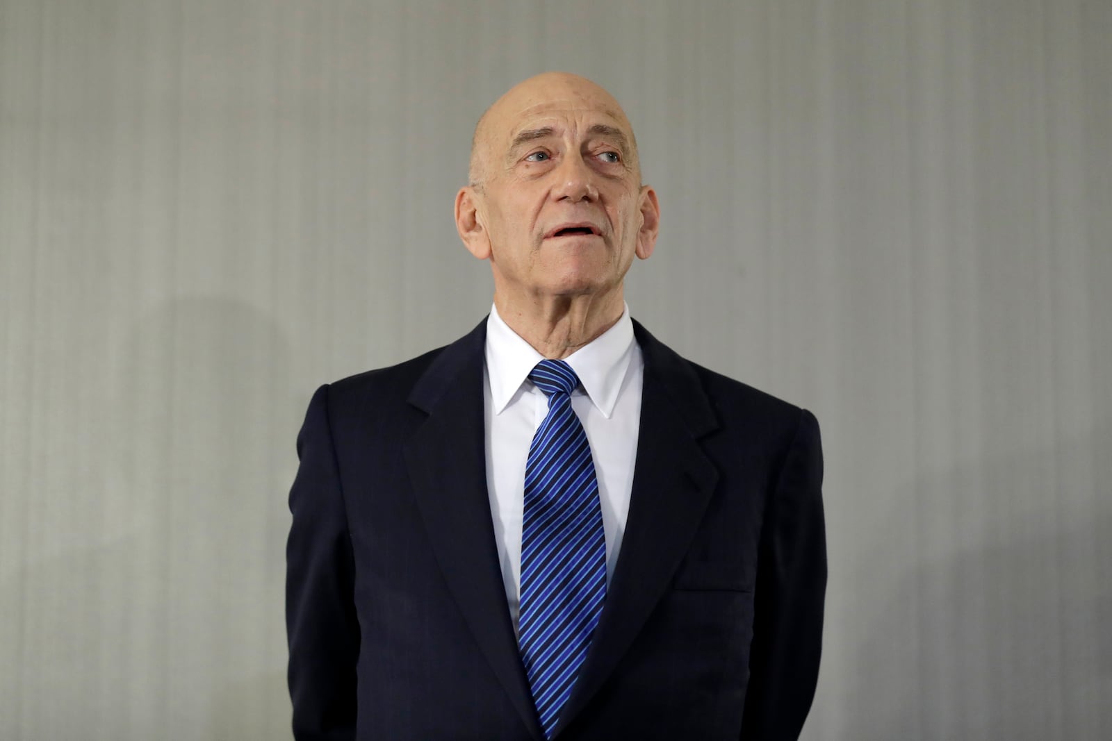 FILE - Former Israeli Prime Minister Ehud Olmert takes questions from reporters after a news conference in New York, Tuesday, Feb. 11, 2020. (AP Photo/Seth Wenig, File)