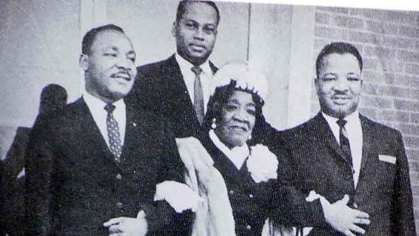 Family matriarch Alberta Williams King (center), wearing a white feathered hat, is flanked by her sons, the Rev. Martin Luther King Jr. (left) and A.D. King (right). Isaac Newton Farris, the husband of her daughter, Christine, stands behind them. (AJC file)