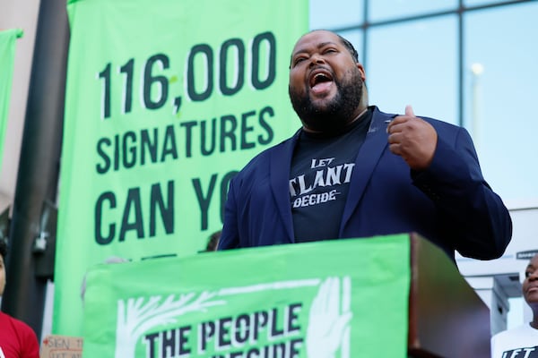 John R Taylor III of Black Male Initiative Georgia speaks during a press conference outside the City Hall; opponents of Atlanta’s planned public safety training center intended to present their petition with 100,000 signatures to Atlanta on Monday, Sept. 10, 2023. 
Miguel Martinez /miguel.martinezjimenez@ajc.com