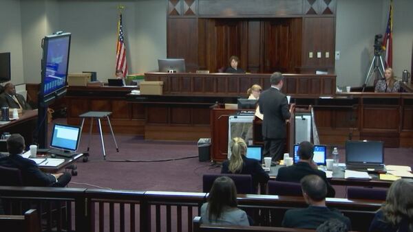 Prosecutor Chuck Boring (center) cross examines Leanna Taylor, the ex-wife of Justin Ross Harris, on her second day of testimony, during Harris' murder trial at the Glynn County Courthouse in Brunswick, Ga., on Tuesday, Nov. 1, 2016. (screen capture via WSB-TV)