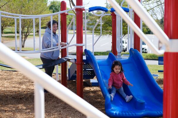 Fran Wunderlich plays with her granddaughter Lily Wunderlich at Lost Mountain Park in Cobb County on Wednesday, April 20, 2022. (Arvin Temkar / arvin.temkar@ajc.com)