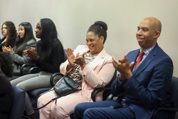 Gwinnett County District Attorney Patsy Austin-Gatson (center) and Deputy Chief District Attorney John Williams applaud at the conclusion of a mock trial at their office's Junior District Attorney and Investigator Mentorship Program at the Gwinnett County Justice and Administration Center, Tuesday, June 25, 2024, in Lawrenceville. (Jason Getz / AJC)
