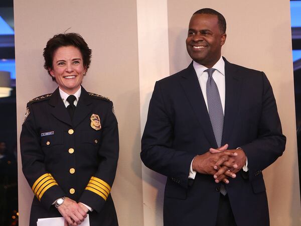 Overtime spending spiked under former Mayor Kasim Reed, right, and the police department accounted for the bulk of the expenses, a city audit found. Chief Erika Shields, left. CURTIS COMPTON / CCOMPTON@AJC.COM