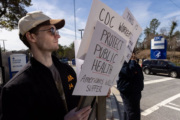 Nicholas Woodruff was among demonstrators protesting the mass firing of Centers for Disease Control and Prevention employees in front of the CDC headquarters in Atlanta on Tuesday, Feb. 18, 2025. (Arvin Temkar/The Atlanta Journal-Constitution/TNS)