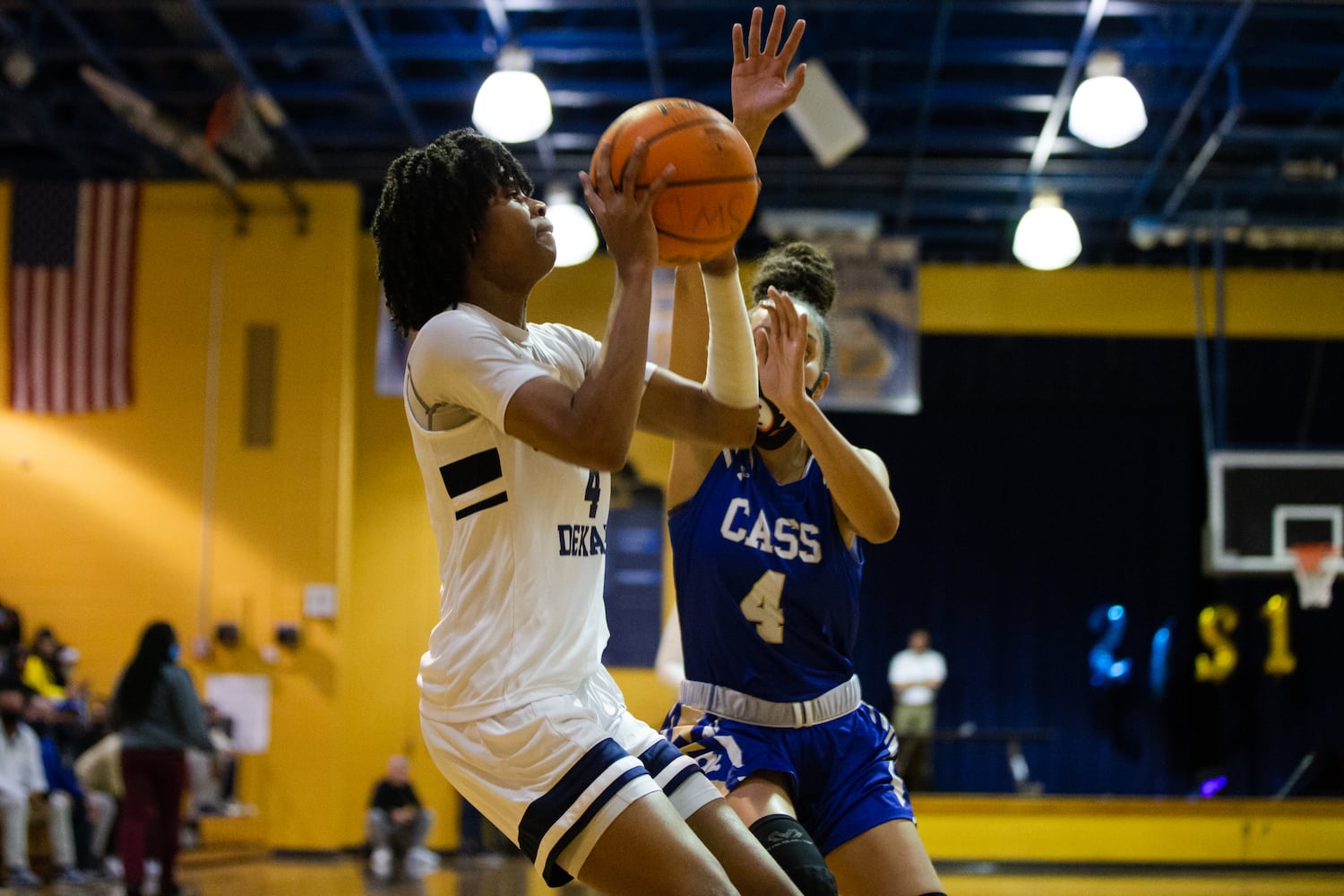 Pryia Thompson (4), guard for South Dekalb High School, shoots under pressure from Ariana Hames (4), guard for Cass Highs School, during the South Dekalb vs. Cass girls basketball playoff game on Friday, February 26, 2021, at South Dekalb High School in Decatur, Georgia. South Dekalb defeated Cass 72-46. CHRISTINA MATACOTTA FOR THE ATLANTA JOURNAL-CONSTITUTION