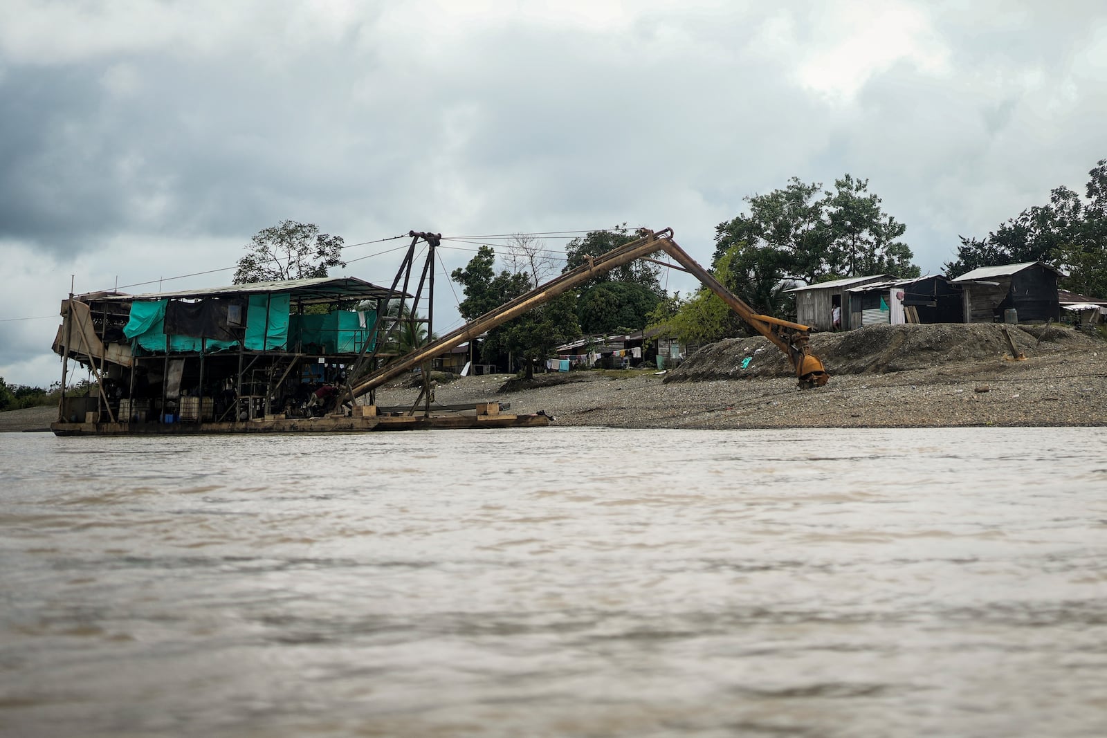 A machine used in extracting gold sits on the Quito River, near Paimado, Choco state, Colombia, Monday, Sept. 23, 2024. (AP Photo/Ivan Valencia)