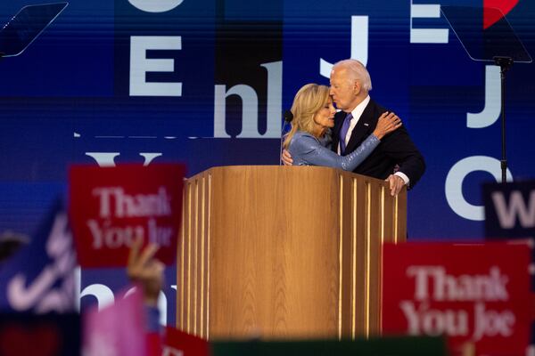 President Joe Biden and first lady Jill Biden embrace after his speech on the first day of the Democratic National Convention in Chicago on Monday.