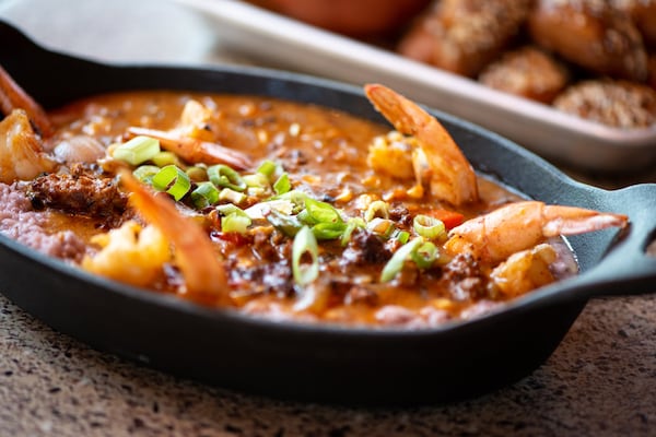 Shrimp and Grits with pan-seared jumbo shrump, cheesy blue corn grits from Geechie Boy