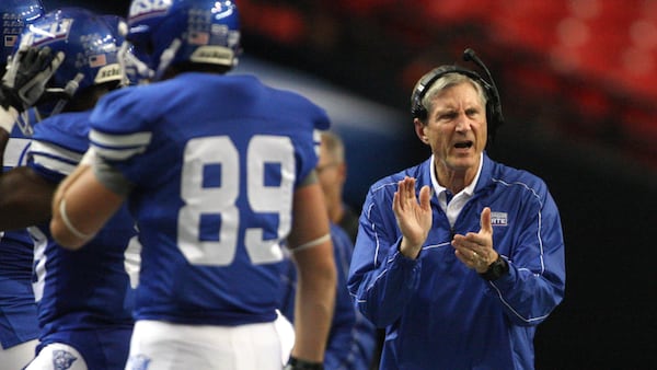 Bill Curry cheers on his Georgia State team in a 2012 game against Villanova at the Georgia Dome.  JASON GETZ / JGETZ@AJC.COM