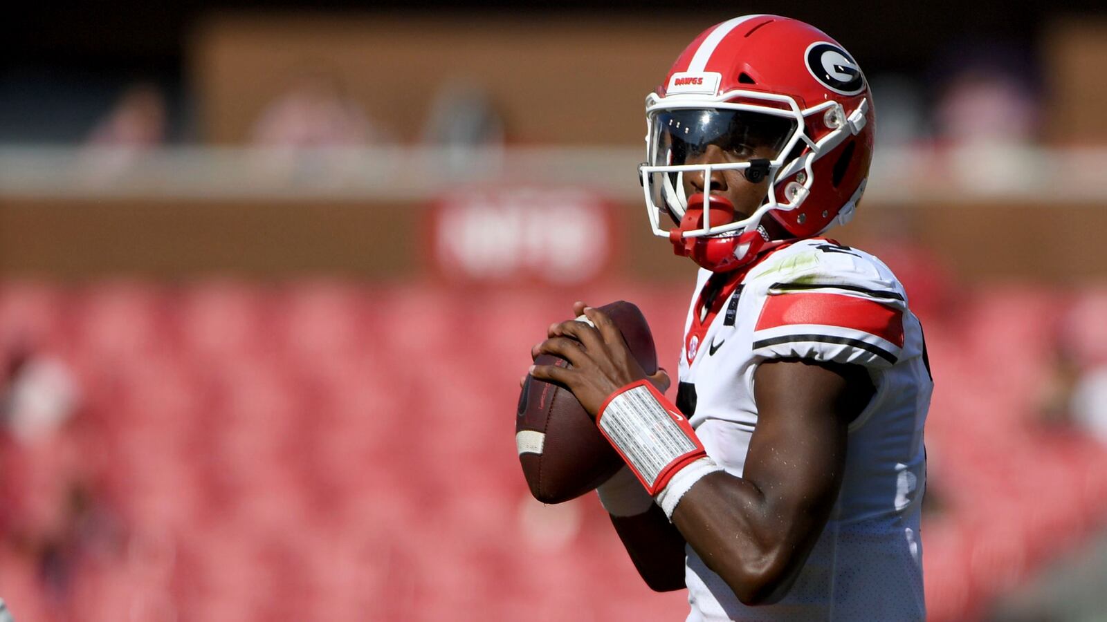 Georgia quarterback D'Wan Mathis drops back to pass against during the first half of the team's NCAA college football game against Arkansas in Fayetteville, Ark., Saturday, Sept. 26, 2020. (AP Photo/Michael Woods)