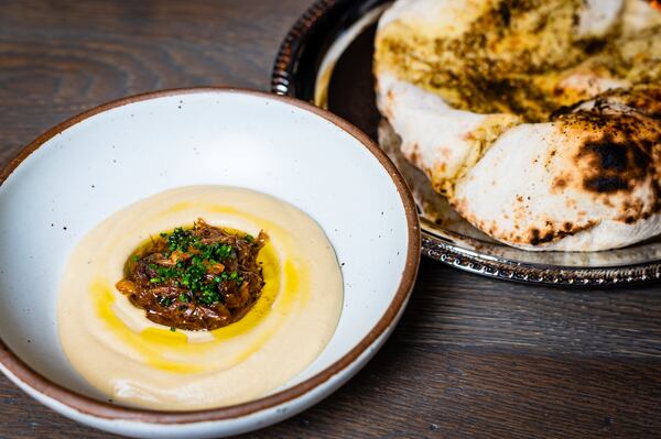 Hummus No. 2 is one of the excuses to enjoy wood-oven baked laffa flatbread at Aziza. CONTRIBUTED BY HENRI HOLLIS