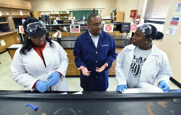 Dr. Randall Harris, assistant professor of Chemistry, helps students in a lab at Claflin University. (HYOSUB SHIN / HSHIN@AJC.COM)