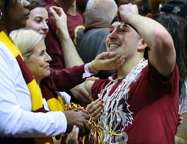 March 24, 2018 Atlanta: Loyola guard Ben Richardson celebrates with fans after beating Kansas State 78-62 in their regional final NCAA college basketball game on Saturday, March 24, 2018, in Atlanta.  Curtis Compton/ccompton@ajc.com