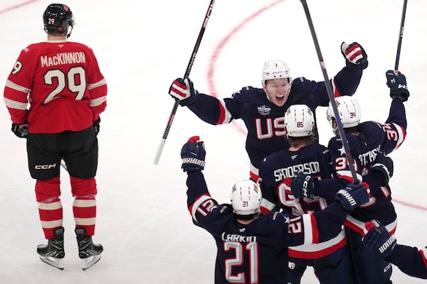 United States' Jake Sanderson (85) is congratulated after his goal against Canada during the second period of the 4 Nations Face-Off championship hockey game, Thursday, Feb. 20, 2025, in Boston. (AP Photo/Charles Krupa)