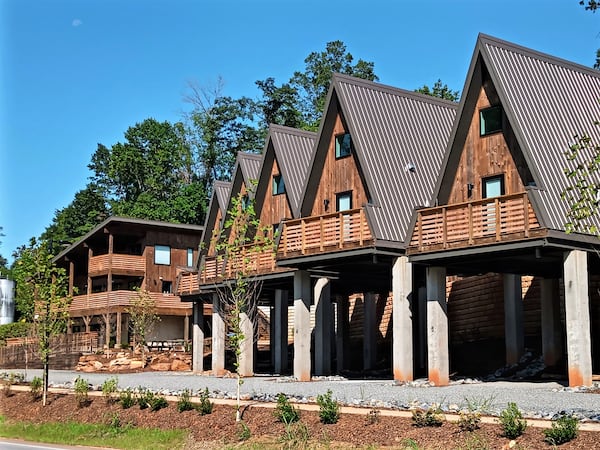 Accommodations at the Wrong Way River Lodge and Cabins are small A-frame units with parking underneath and balconies overlooking Asheville's French Broad River Greenway Park near the River Arts District.
Courtesy of Blake Guthrie