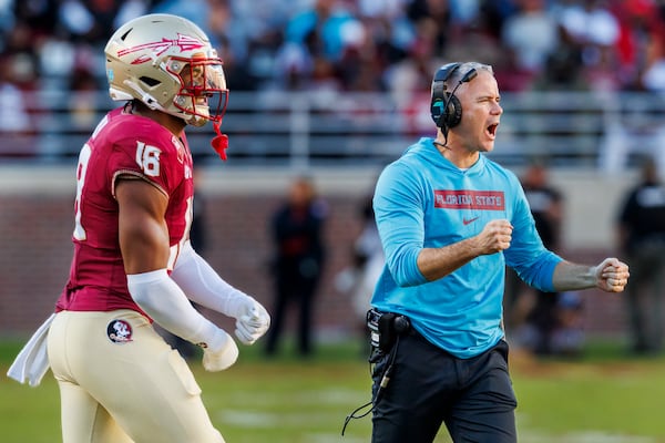 Florida State head coach Mike Norvell and linebacker Cam Riley (18) react after Charleston Southern missed a field goal during the second half of an NCAA college football game, Saturday, Nov. 23, 2024, in Tallahassee, Fla. (AP Photo/Colin Hackley)