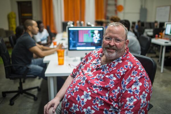 Tim Byrne poses for a portrait in Lamp Camp, a part of Cresca Group where he is head of the Marketing Department, Thursday, June 11, 2015, in Peachtree Corners, Ga. Byrne, 55, uses Obamacare to to fill his healthcare needs.