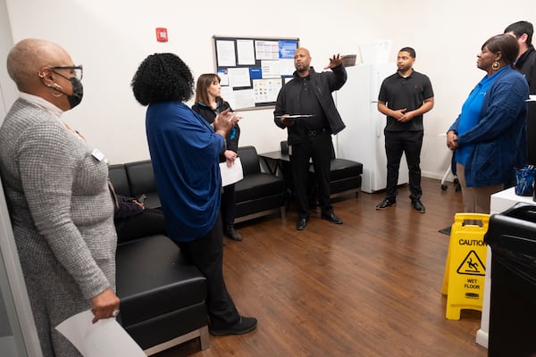 Joe Bagett Jr., regional manager and career navigator for Goodwill of North Georgia, briefs employees before they meet with recruits for the inaugural Clean Tech training program at the Goodwill Career Center in Decatur on Monday, Jan. 8, 2024.   (Ben Gray / Ben@BenGray.com)