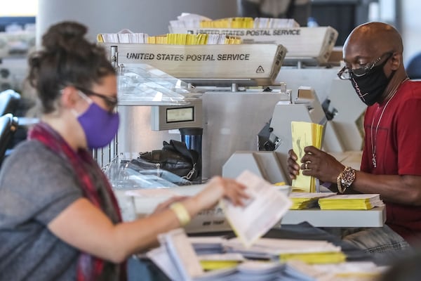 Fulton County election workers counted ballots at State Farm Arena on Nov. 5, 2020. (John Spink/AJC)