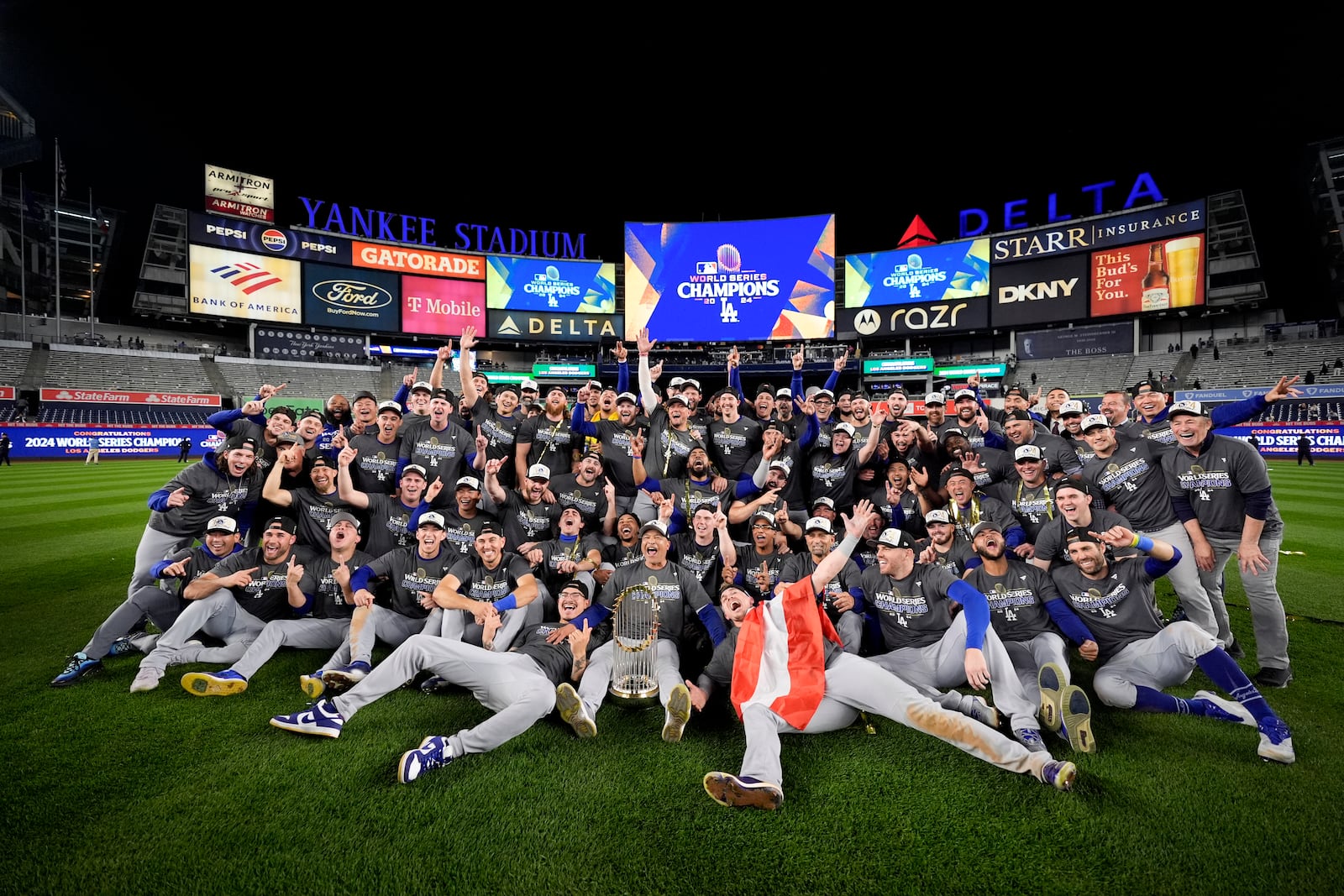 The Los Angeles Dodgers pose for a team picture after their win against the New York Yankees in Game 5 to win the baseball World Series, Thursday, Oct. 31, 2024, in New York. (AP Photo/Ashley Landis)