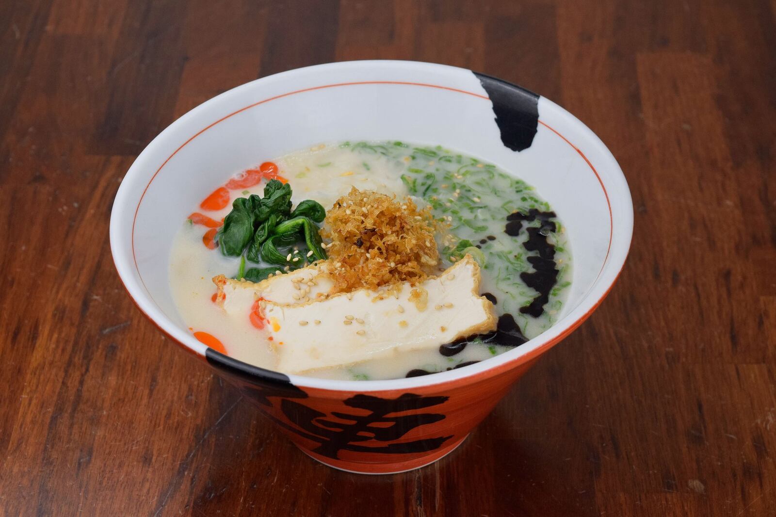 The intensely creamy and savory broth of the vegan ramen at Jinya clings to thick noodles made fresh daily. CONTRIBUTED BY LAUREN LIZ PHOTO