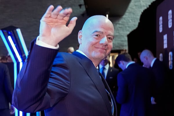 FIFA president Gianni Infantino waves at the UEFA Preliminary Draw for the 2026 FIFA World Cup at FIFA headquarters in Zurich, Switzerland, Friday, December 13, 2024. (AP Photo/Martin Meissner)