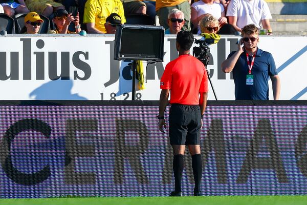 FILE - Referee Mohammad Usman Aslam checks VAR during the football match between Bodo Glimt and Sandefjord at Aspmyra Stadium, Bodo, Norway, May. 29, 2024. (Mats Torbergsen/NTB via AP, file)