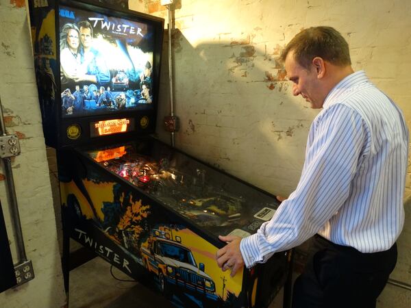 Mike Bettes made a special request: he wanted a vintage 1996 Sega "Twister" movie themed pinball machine for the set. And he got it! CREDIT: Rodney Ho/ rho@ajc.com