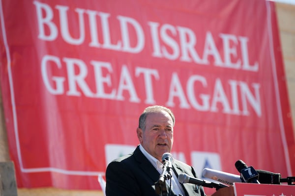 FILE - Gov. Mike Huckabee, R-Ark., takes questions from the media, prior to laying a brick at a new housing complex in the West Bank settlement of Efrat, Aug. 1, 2018. President-elect Donald Trump will nominate former Arkansas Gov. Mike Huckabee as ambassador to Israel. Trump said Tuesday that Huckabee is a staunch defender of Israel and his intended nomination comes as Trump has promised to align U.S. foreign policy more closely with Israel’s interests as it wages wars against Hamas in Gaza and Hezbollah in Lebanon.(AP Photo/Oded Balilty, File)