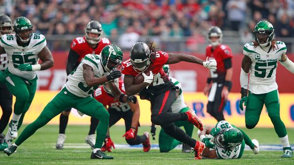 Falcons running back Cordarrelle Patterson (84) runs with the ball during the first half against the New York Jets Sunday, Oct. 10, 2021, at the Tottenham Hotspur stadium in London, England. (Ian Walton/AP)