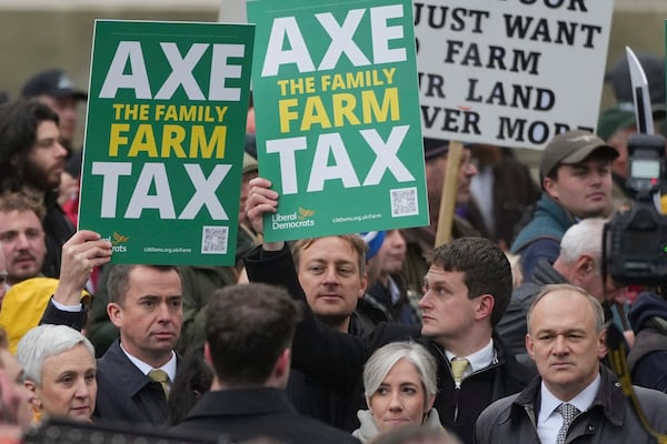 The National Farmers' Union members attend a protest against the planned changes to tax rules, in London, Tuesday, Nov. 19, 2024. (AP Photo/Kin Cheung)